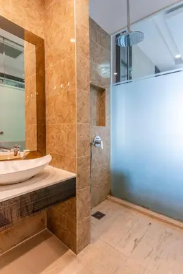 a bathroom with a sink and a shower at Dorsett Bukit Bintang near Pavilion KL, Kuala Lumpur in Kuala Lumpur