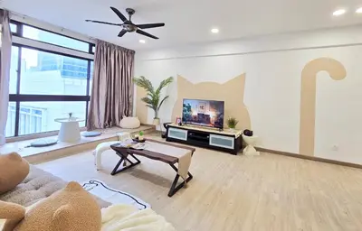 a living room with a couch and a tv at The Meow Loft Fahrenheit Bukit Bintang Kuala Lumpur - Pavilion - KLCC in Kuala Lumpur