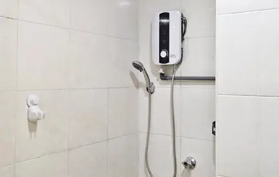 a bathroom with a shower with a phone on the wall at The Meow Loft Fahrenheit Bukit Bintang Kuala Lumpur - Pavilion - KLCC in Kuala Lumpur