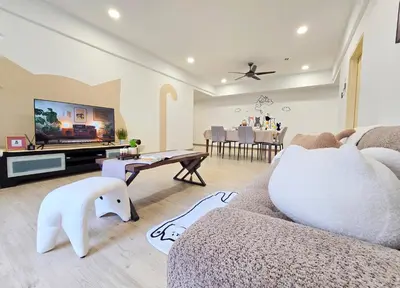 a living room with a couch and a tv at The Meow Loft Fahrenheit Bukit Bintang Kuala Lumpur - Pavilion - KLCC in Kuala Lumpur