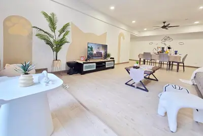 a living room with white furniture and a tv at The Meow Loft Fahrenheit Bukit Bintang Kuala Lumpur - Pavilion - KLCC in Kuala Lumpur