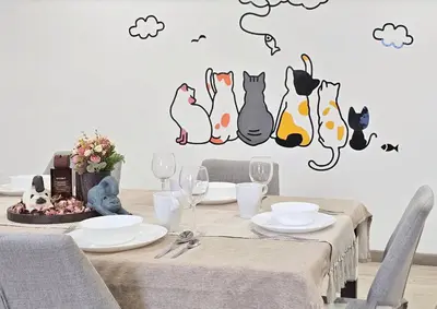 a dining room with a table with cats wall decals at The Meow Loft Fahrenheit Bukit Bintang Kuala Lumpur - Pavilion - KLCC in Kuala Lumpur