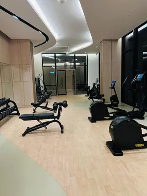 a gym with several treadmills and exercise bikes at Axon suites bukit bintang Klcc by Aura in Kuala Lumpur