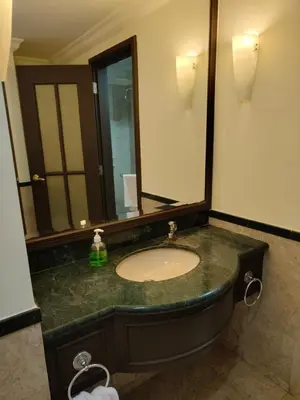 a bathroom with a sink and a large mirror at Visitor Suites At Times Square Kuala Lumpur in Kuala Lumpur