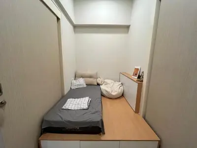 a small room with a bed in the corner at Star Residences One klcc in Kuala Lumpur