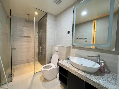 a bathroom with a toilet and a sink and a shower at Star Residences One klcc in Kuala Lumpur