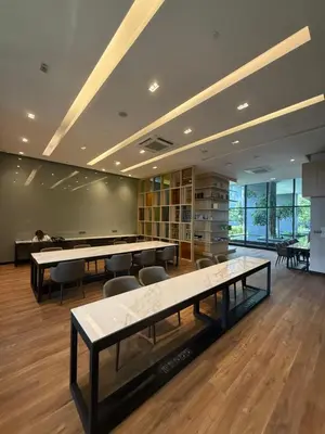 a large room with tables and chairs in it at Star Residences One klcc in Kuala Lumpur