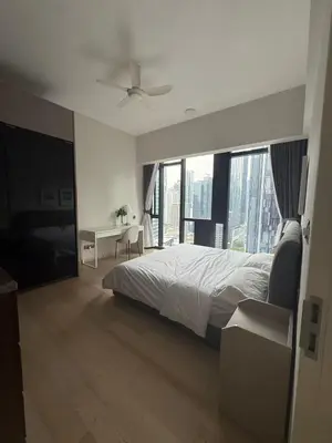a bedroom with a bed and a ceiling fan at Star Residences One KLCC in Kuala Lumpur