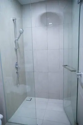 a shower with a glass door in a bathroom at Luxury Apartment - DATUM JELATEK - KLCC- LRT - MDMT - MALL - PARKING in Kampong Datok Keramat