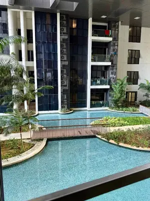 a swimming pool in the middle of a building at Garden Balcony 2BR Home with Great Facilities and Parking in Kuala Lumpur