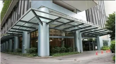 a building with blue columns and a building at Summer Suites KLCC in Kuala Lumpur