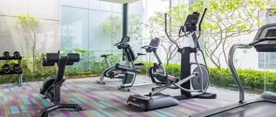 a gym with several exercise bikes in a room at Summer Suites KLCC in Kuala Lumpur