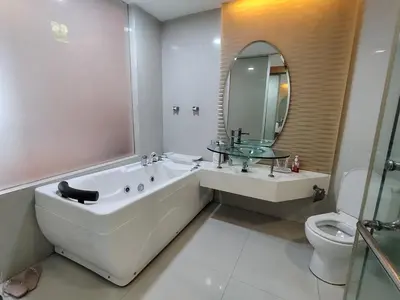 a bathroom with a tub and a sink and a toilet at KL studio with Private Jacuzzi in Kuala Lumpur