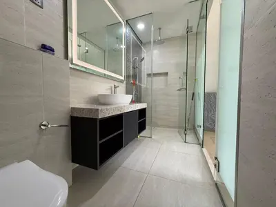 a bathroom with a sink and a glass shower at STAR Suites Residence KLCC in Kuala Lumpur