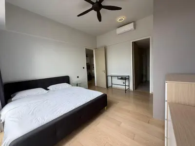 a bedroom with a bed and a ceiling fan at Star Residences One KLCC in Kuala Lumpur