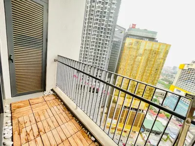 a balcony with a view of a city with tall buildings at KLCC Service Suites at Mews in Kuala Lumpur