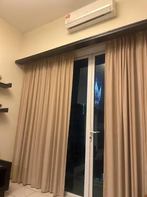a window with curtains and a air conditioner on the wall at Bukit bintang central seri Bukit Ceylon in Kuala Lumpur
