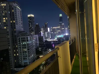 a view of a city at night from a balcony at Bukit bintang central seri Bukit Ceylon in Kuala Lumpur