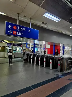 a baggage claim area at an airport with luggage carts at Metro Studio - Direct LRT access, near Pantai Hospital, University Malaya, Mid Valley, Bangsar in Kuala Lumpur