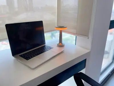 a laptop computer sitting on a desk next to a window at Casa Residency Apartment Bukit Bintang by Cupid home in Kuala Lumpur