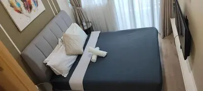 a hospital bed in a room with a blue bed sidx sidx sidx at Sky Touch Homestay in Kuala Lumpur