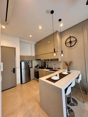 a kitchen with a large island in the middle at Lucentia residence by lalaport in Kuala Lumpur