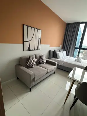 a living room with a couch and a bed at Ubays Majestic House in Kuala Lumpur