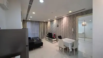 a living room with a table and a couch at KLCC Bukit Bintang Binjai 8 premium soho by Prime Suites in Kuala Lumpur