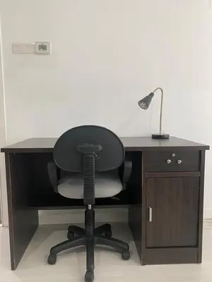 a black desk with a chair and a lamp at KLCC Bukit Bintang Binjai 8 premium soho by Prime Suites in Kuala Lumpur