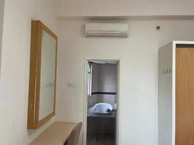 a bathroom with a sink and a mirror at Kuala Lumpur city centre in Kuala Lumpur