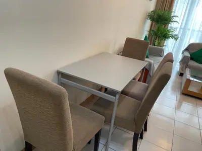 a white table and chairs in a room at Kuala Lumpur city centre in Kuala Lumpur