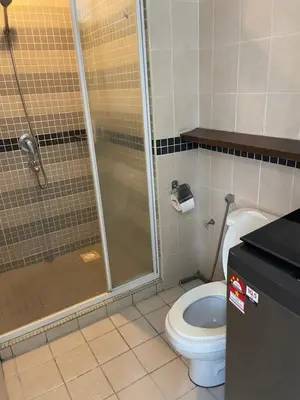 a bathroom with a shower and a toilet at Kuala Lumpur city centre in Kuala Lumpur