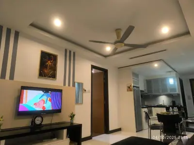 a living room with a flat screen tv on a wall at 0108 Casa Residency- Sweet Home 2R 2B in Kuala Lumpur