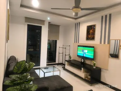 a living room with a couch and a flat screen tv at 0108 Casa Residency- Sweet Home 2R 2B in Kuala Lumpur
