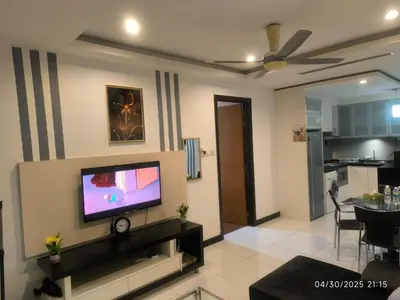 a living room with a flat screen tv on a wall at 0108 Casa Residency- Sweet Home 2R 2B in Kuala Lumpur