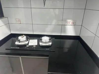 a black counter top with two clocks on it at The Valley, SkySierra KL in Kuala Lumpur