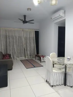 a living room with a table and a ceiling fan at The Valley, SkySierra KL in Kuala Lumpur
