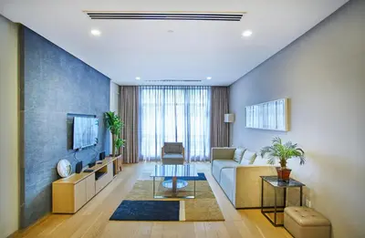 a living room with a couch and a tv at 188 Suites near KLCC with Parking and Bathtub in Kuala Lumpur