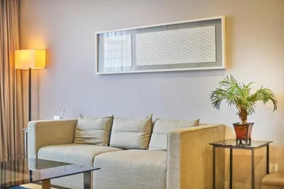 a living room with a couch and a table at 188 Suites near KLCC with Parking and Bathtub in Kuala Lumpur