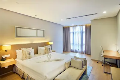 a hotel room with a large bed and a desk at 188 Suites near KLCC with Parking and Bathtub in Kuala Lumpur