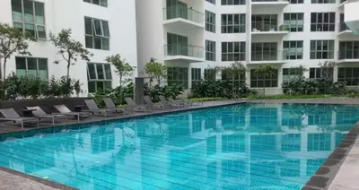 a large swimming pool in front of a building at Infinity Sky Pool, Regalia KLCC in Kuala Lumpur
