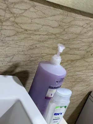a bottle of toothpaste and a container of tooth paste at Infinity Sky Pool, Regalia KLCC in Kuala Lumpur