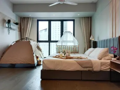 a bedroom with a large bed and a large window at Ooak Suites Mont Kiara Mall 163 Babycot 4 Pax in Kuala Lumpur