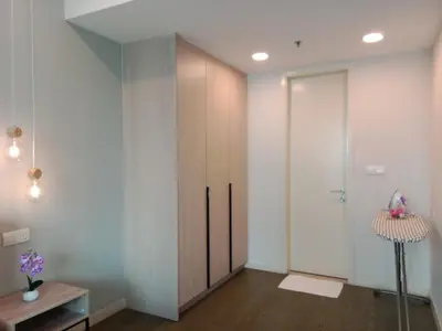 a room with a partition with a door and a table at Ooak Suites Mont Kiara Mall 163 Babycot 4 Pax in Kuala Lumpur