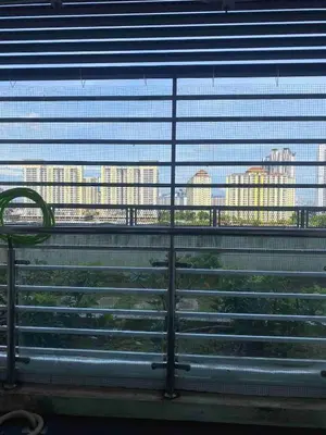a bench in front of a window with a view of buildings at Setapak Central Mall in Kuala Lumpur