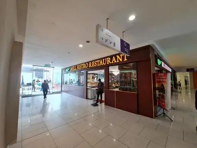 a shopping mall with a sign in the middle of it at Majestic Residence KLCC By AMG in Kuala Lumpur