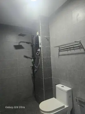 a bathroom with a toilet and a shower stall at Neu Suite 2 Rooms 1 Bath Unit For Rent Free Wi-Fi Deposit RM200 in Kuala Lumpur
