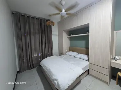 a small bedroom with a bed and a ceiling fan at Neu Suite 2 Rooms 1 Bath Unit For Rent Free Wi-Fi Deposit RM200 in Kuala Lumpur