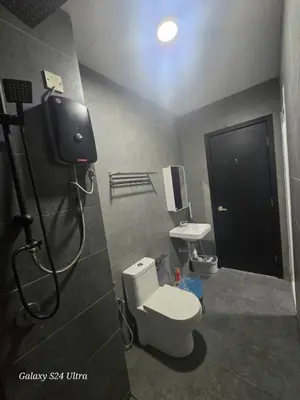 a bathroom with a toilet and a sink at Neu Suite 2 Rooms 1 Bath Unit For Rent Free Wi-Fi Deposit RM200 in Kuala Lumpur