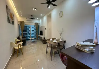 a living room with a table and a dining room at K&L Suites Razak City Kuala Lumpur in Kuala Lumpur
